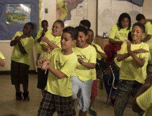A group of elementary-aged boys perform a dance to a classroom-favorite song.